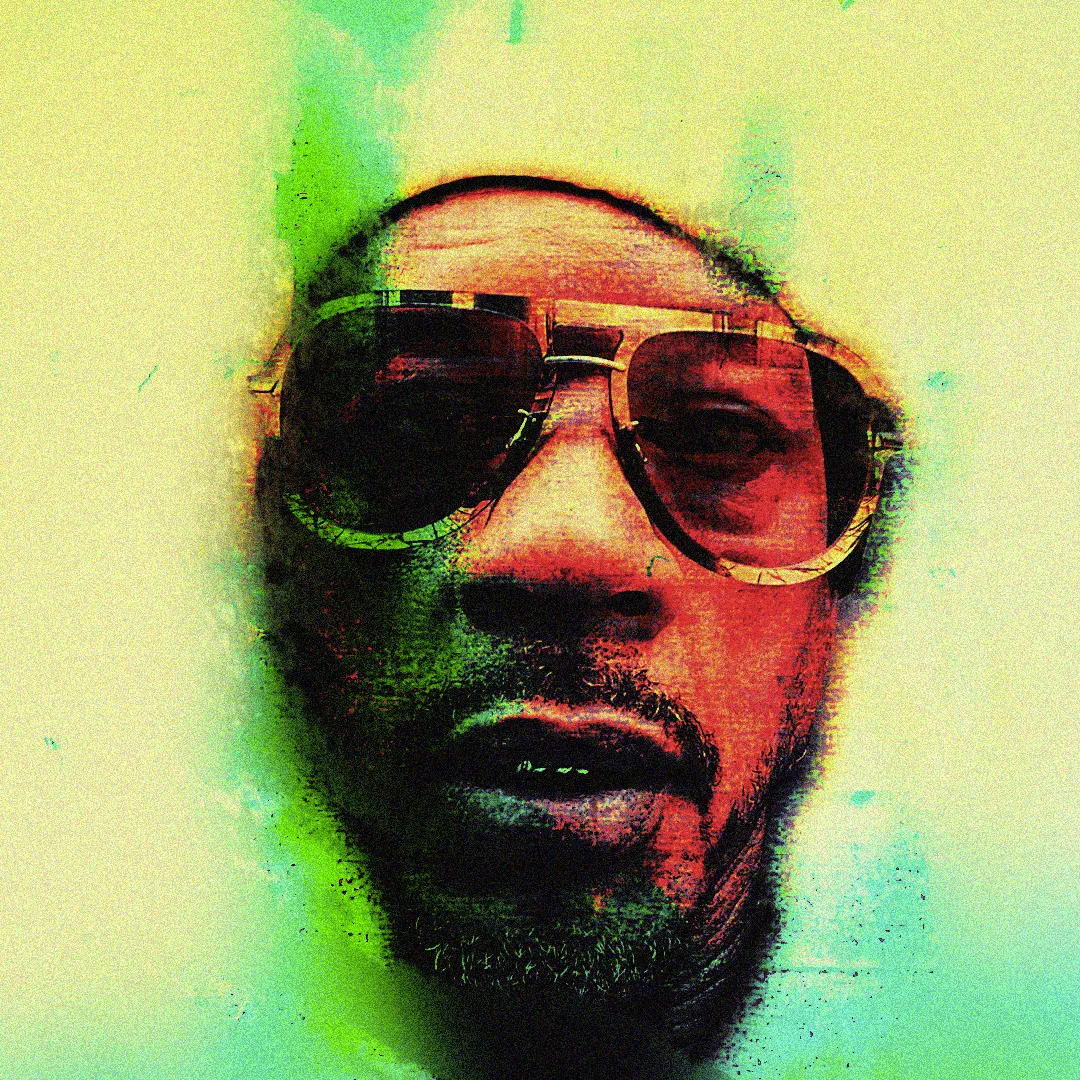 Portrait digital de Joey Starr en lunettes, couleurs rouge, vert et jaune